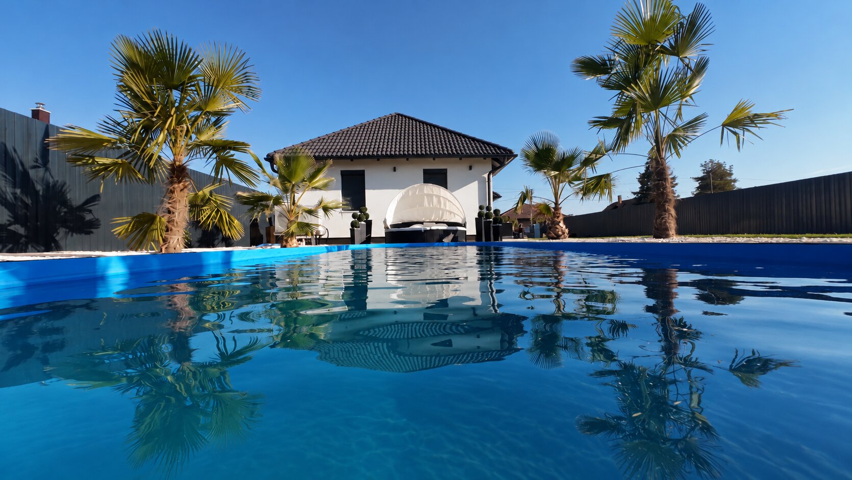 The pool's water surface with the house behind