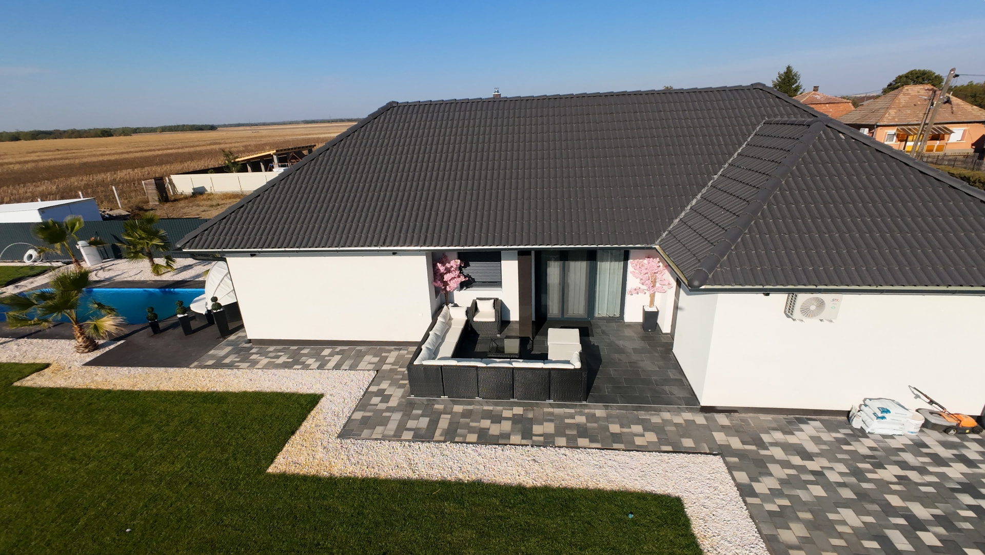 Aerial view of the house and the landscaped yard